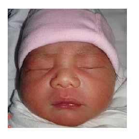 The little face of new baby Kenneth.